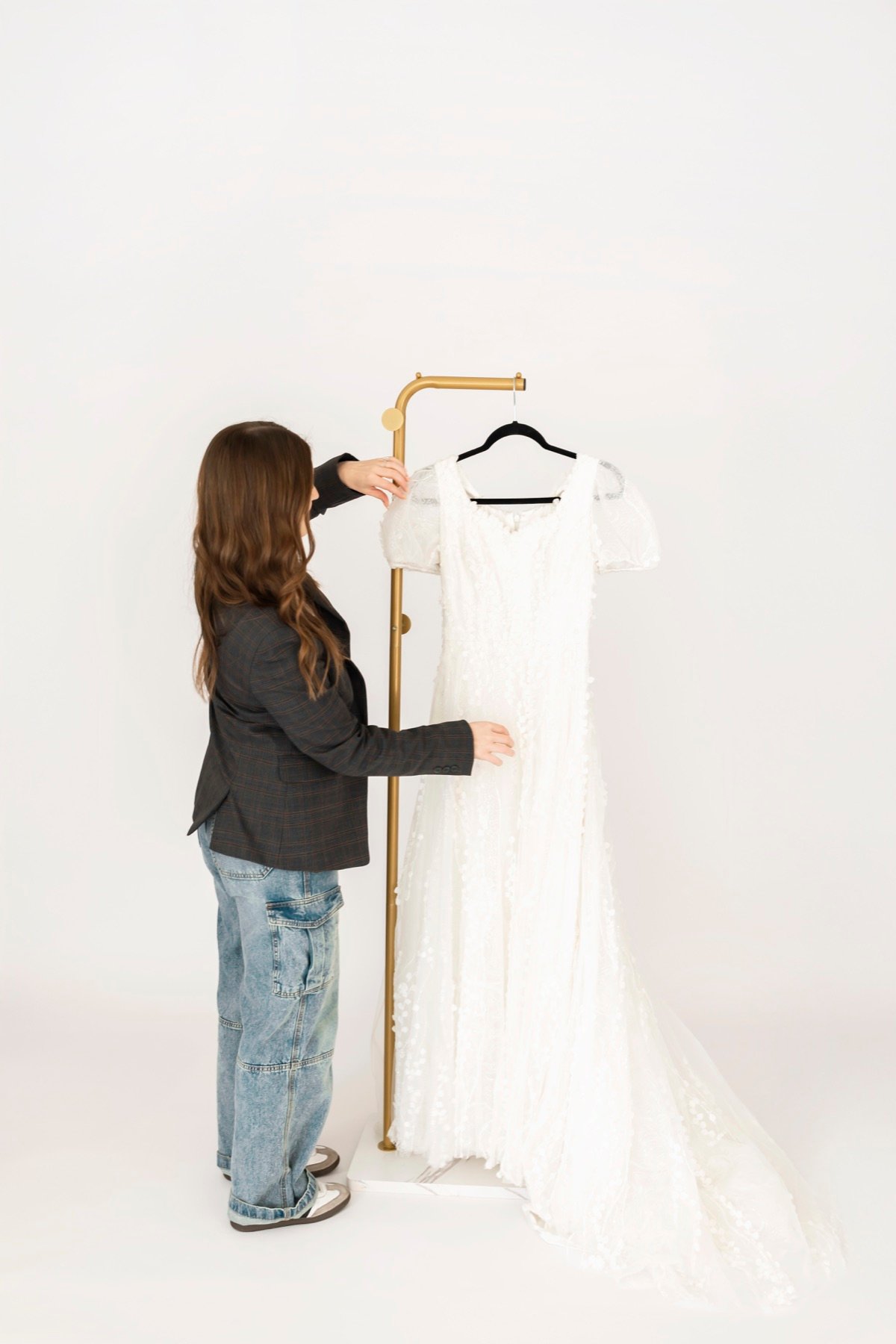 A modest wedding gown prepared for a private appointment