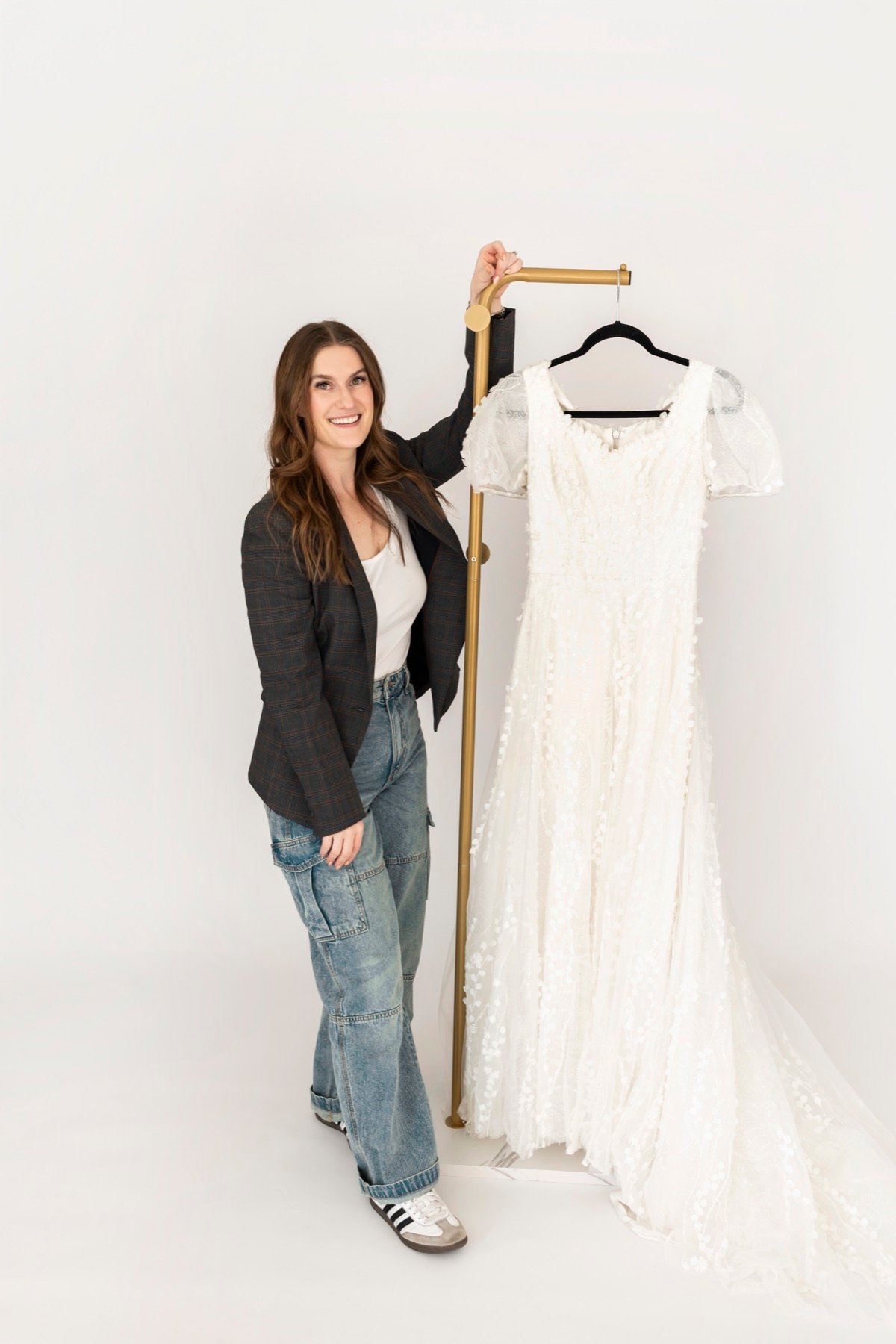 A Laurels & Lace stylist with a wedding gown